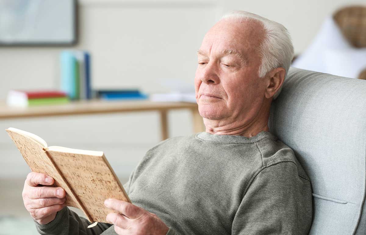 Elderly man in power recliner