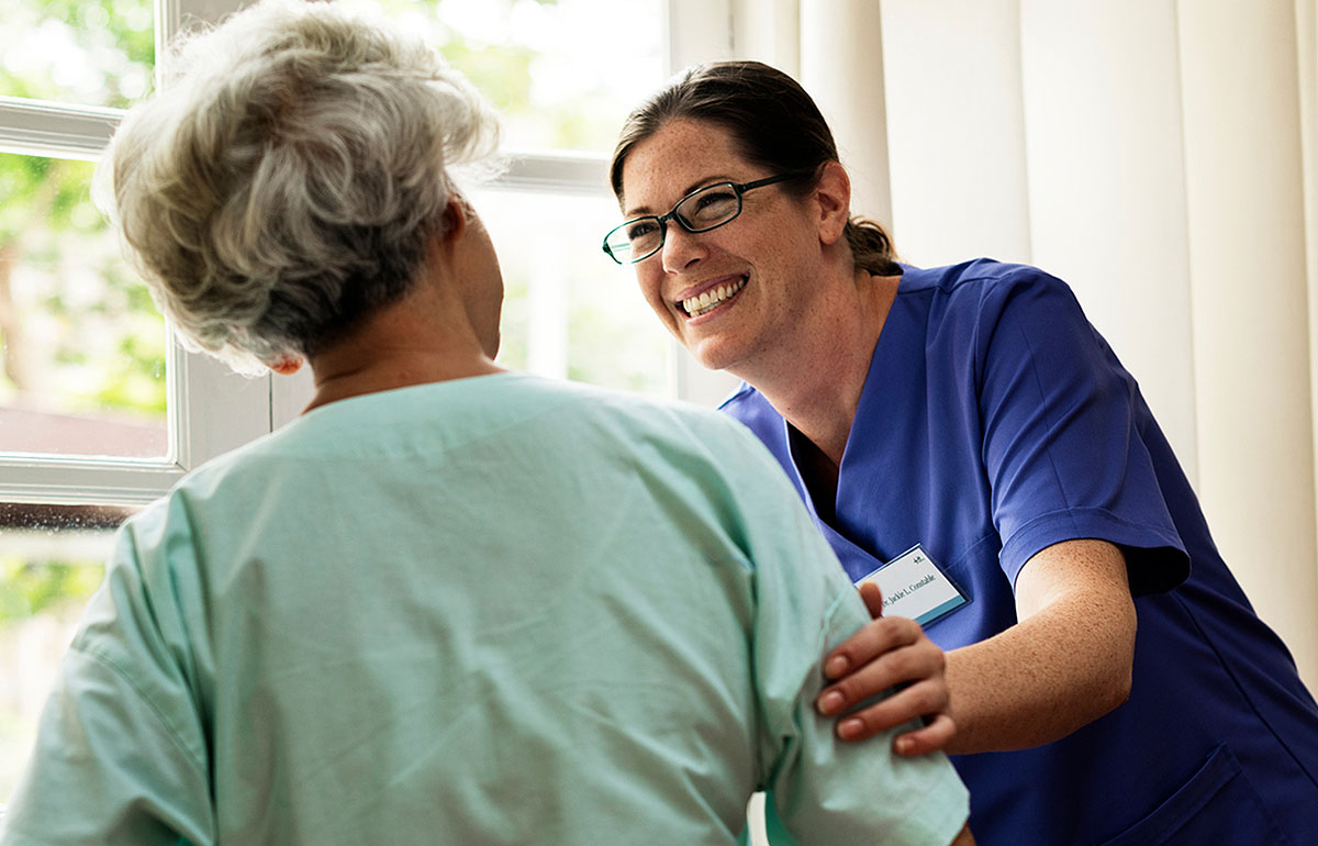 Aged care worker and elderly woman