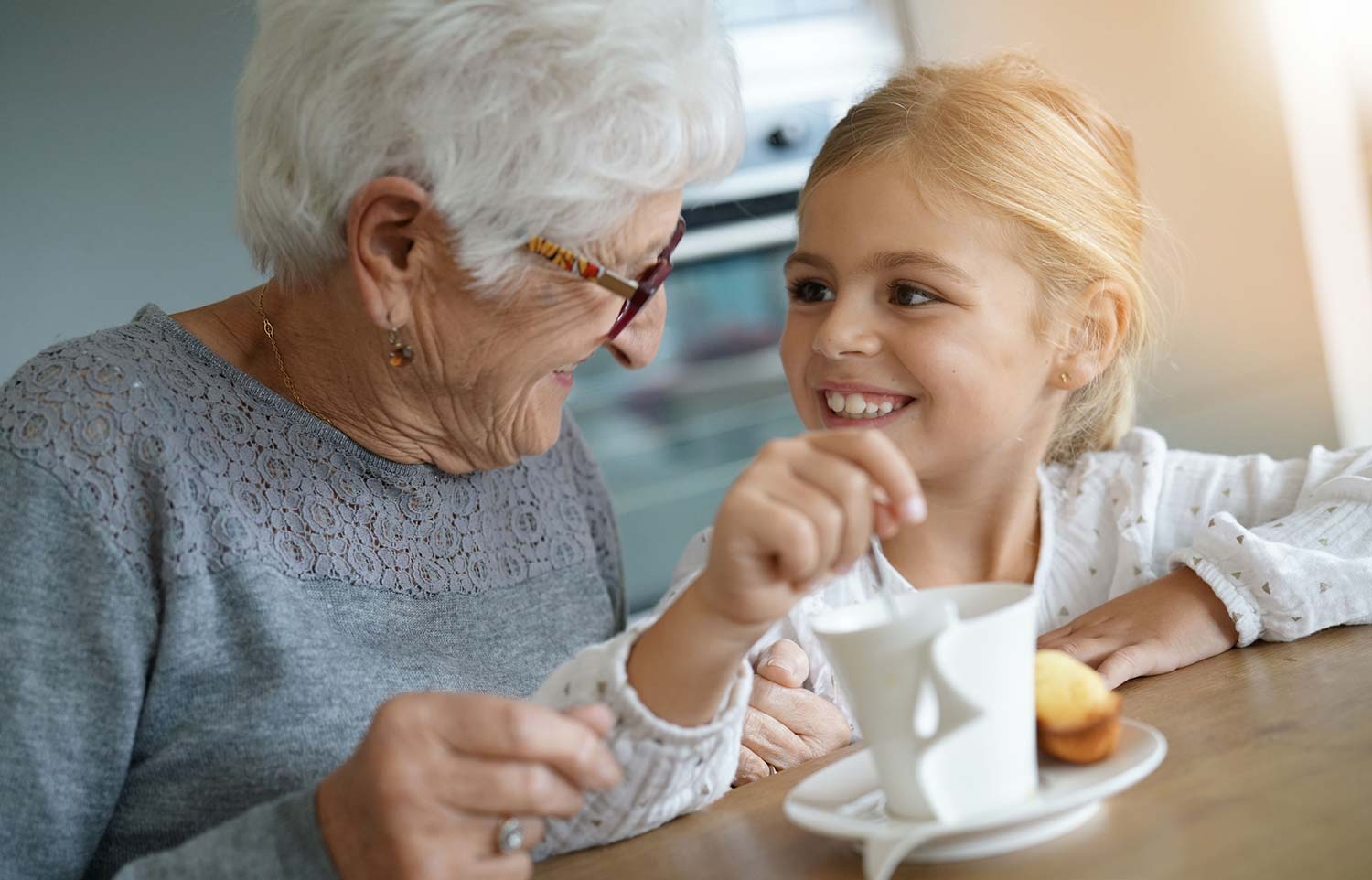 Elderly woman and her grandchild in an aged care facility