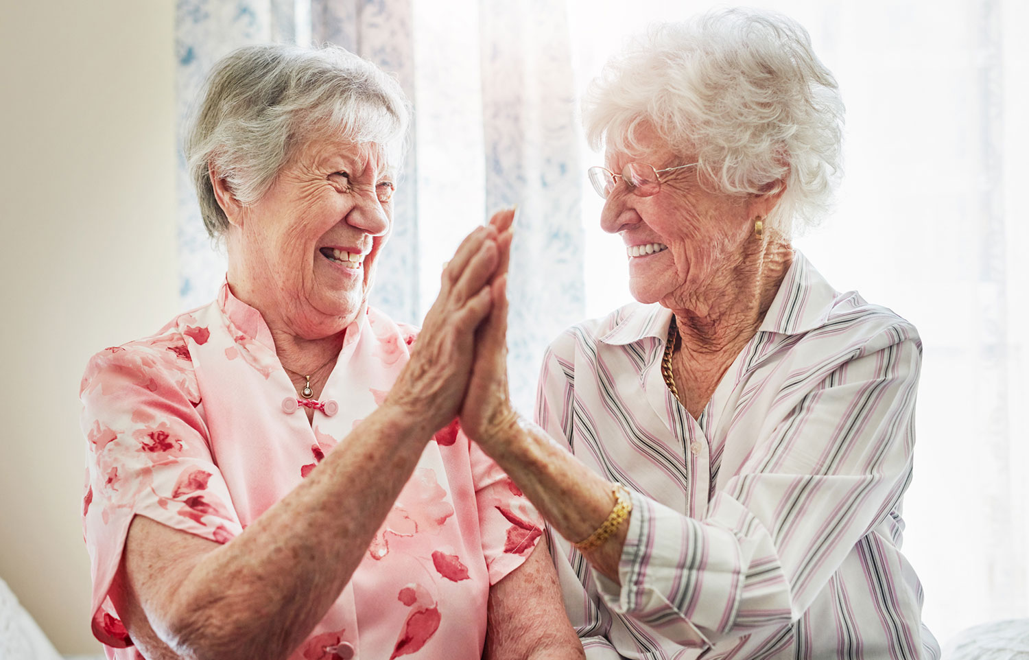 Happy elderly women in aged care facility