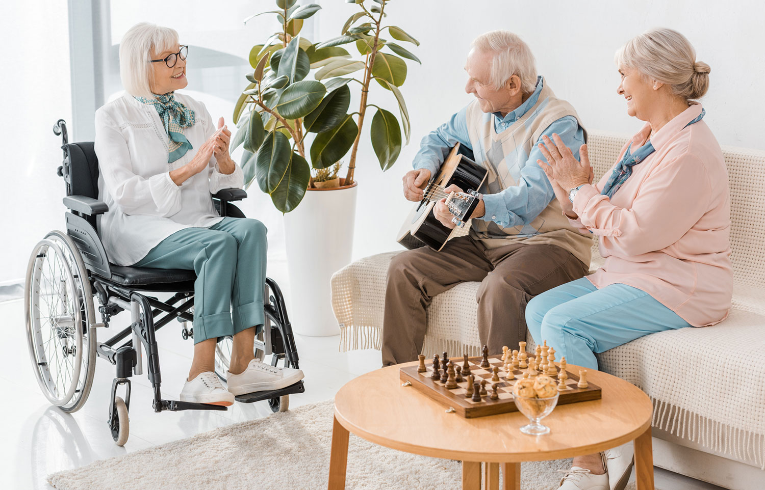 Elderly people sitting near a lounge side table