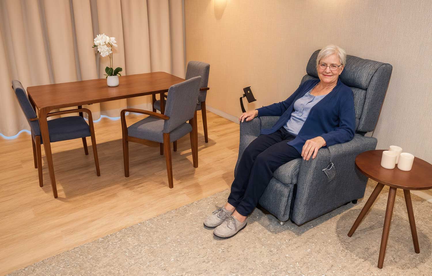 Happy elderly woman in aged care recliner