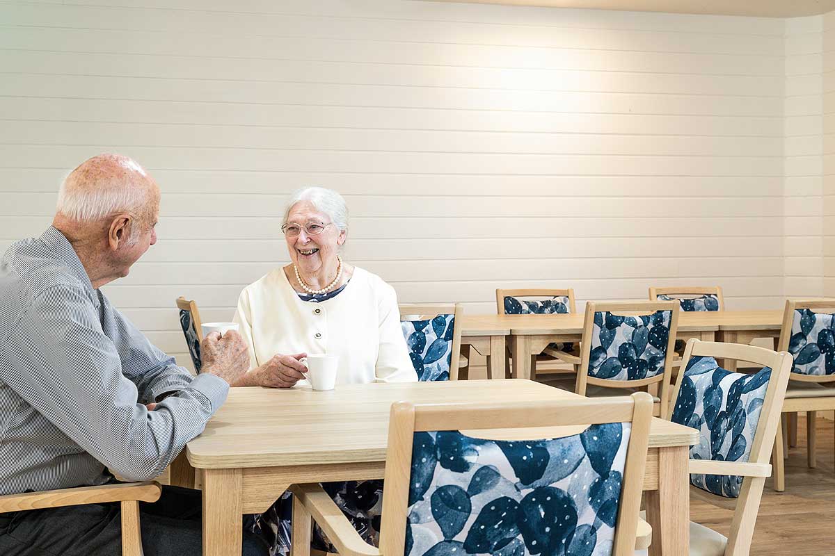 Elderly couple dining in aged care
