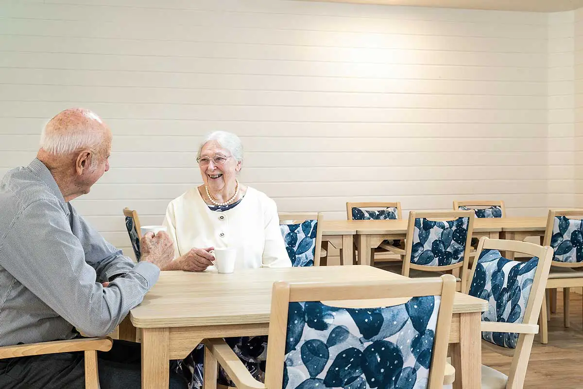Elderly couple dining in aged care